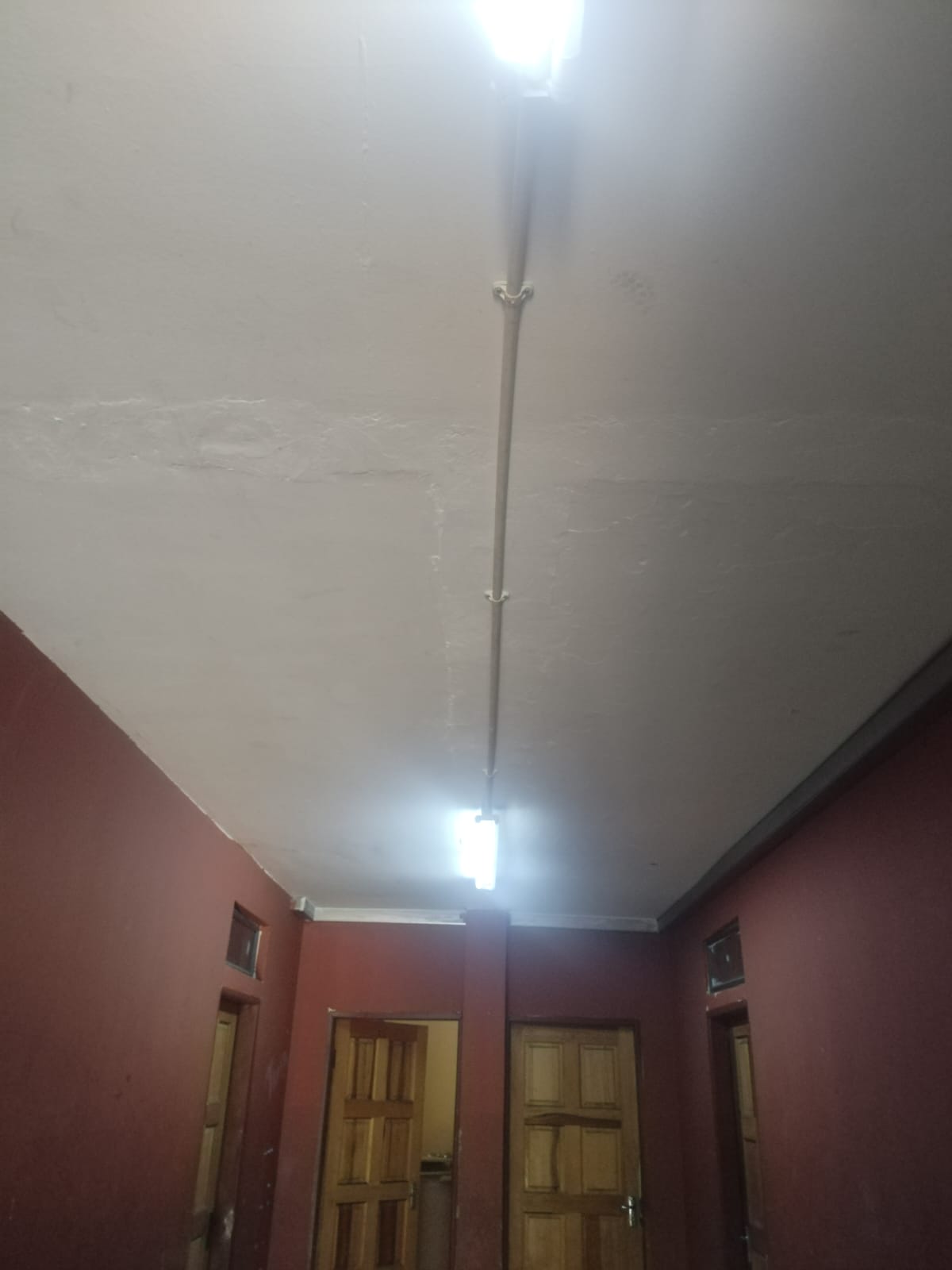 Freshly painted ceiling with lighting installed in a corridor